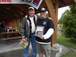 SPC David Amore, hometown – Newark, OH, with Region 8 boat captain Tom Cirilli joyfully receives the Big Fish Award